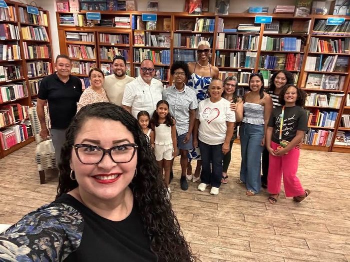 Edward Rodriguez with family and friends in a group selfie at Casa Norberto bookstore