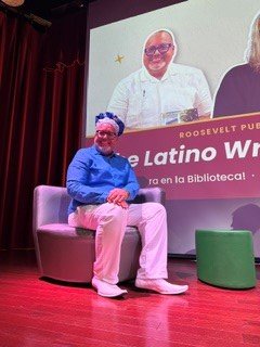 Edward Rodriguez seated on stage during the roundtable discussion